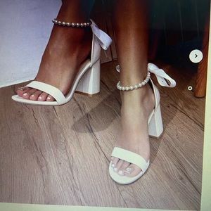 Women’s platform shoes with back bow tie and pearl strap